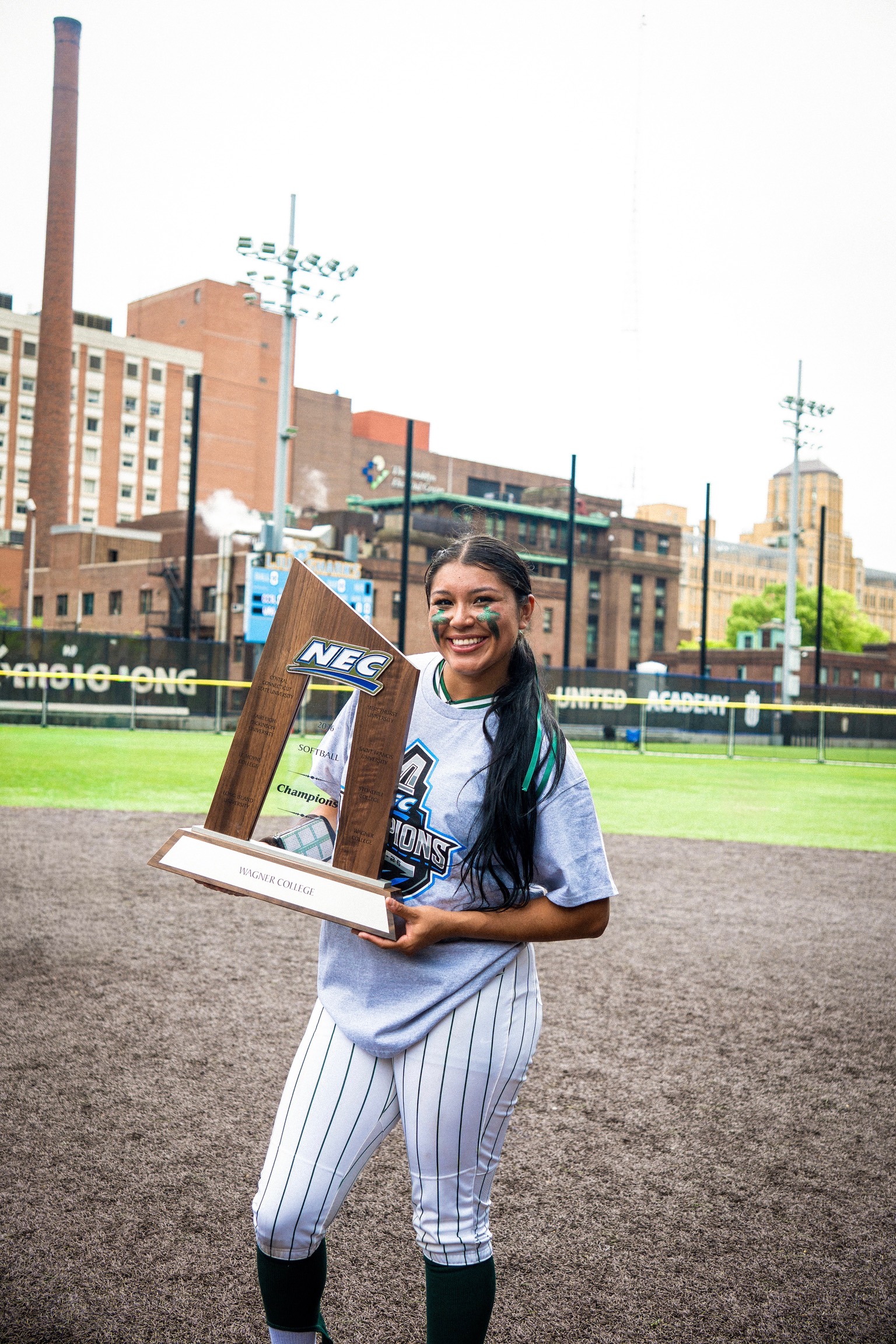 Geanice Morales holding NEC trophy